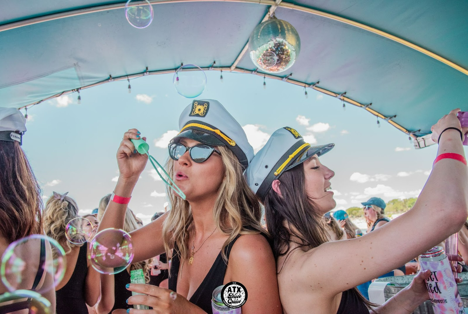 Blowing Bubbles in a bachelorette party in Austin by premier party cruises